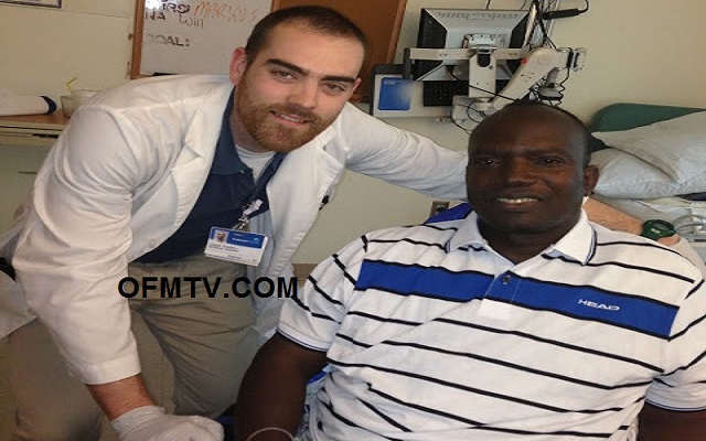 A physiotherapist helping Apostle Dr Michael Ntumy to sit, for the first time after the surgery